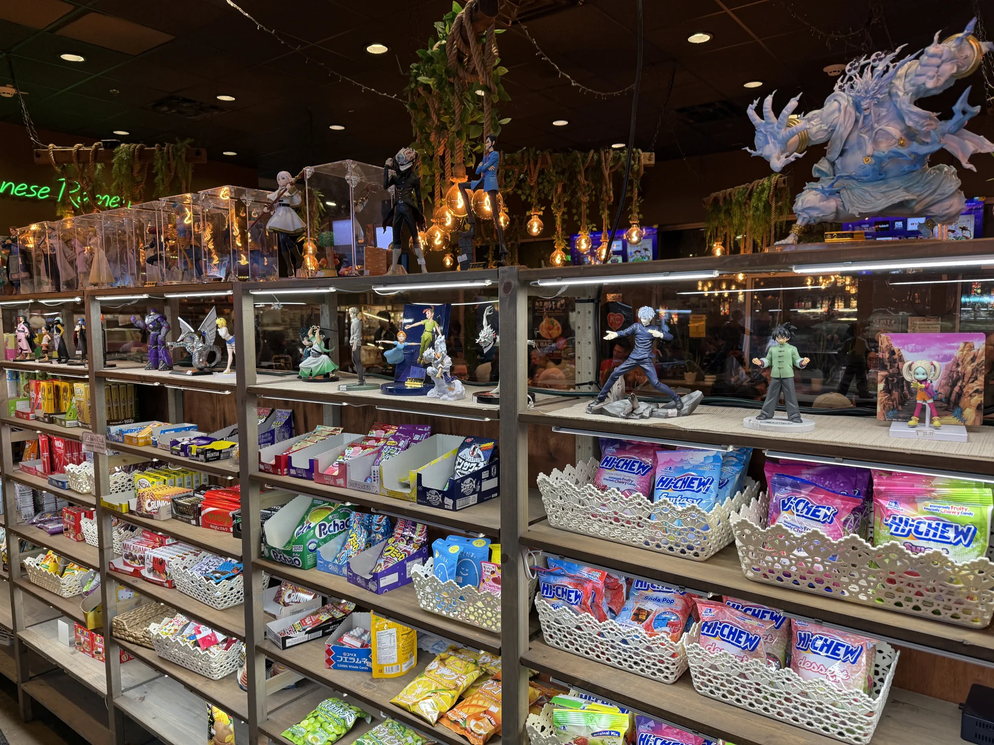 Figures and Japanese snacks for sale inside KC Craft Ramen